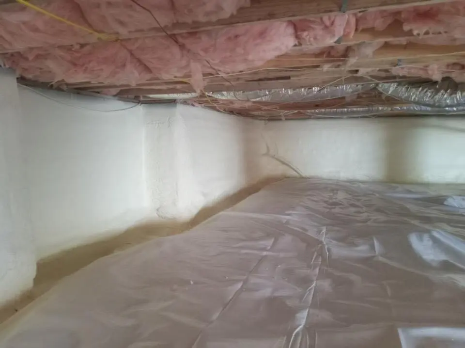 Crawl space encapsulation with closed-cell spray foam for Commercial Roof Restoration in Peters